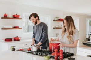 a man and a woman in a kitchen